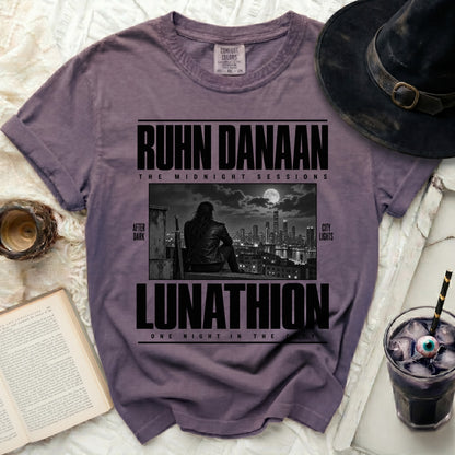 Purple t-shirt with "RUHN DANAAN LUNATHION" text and city scene.