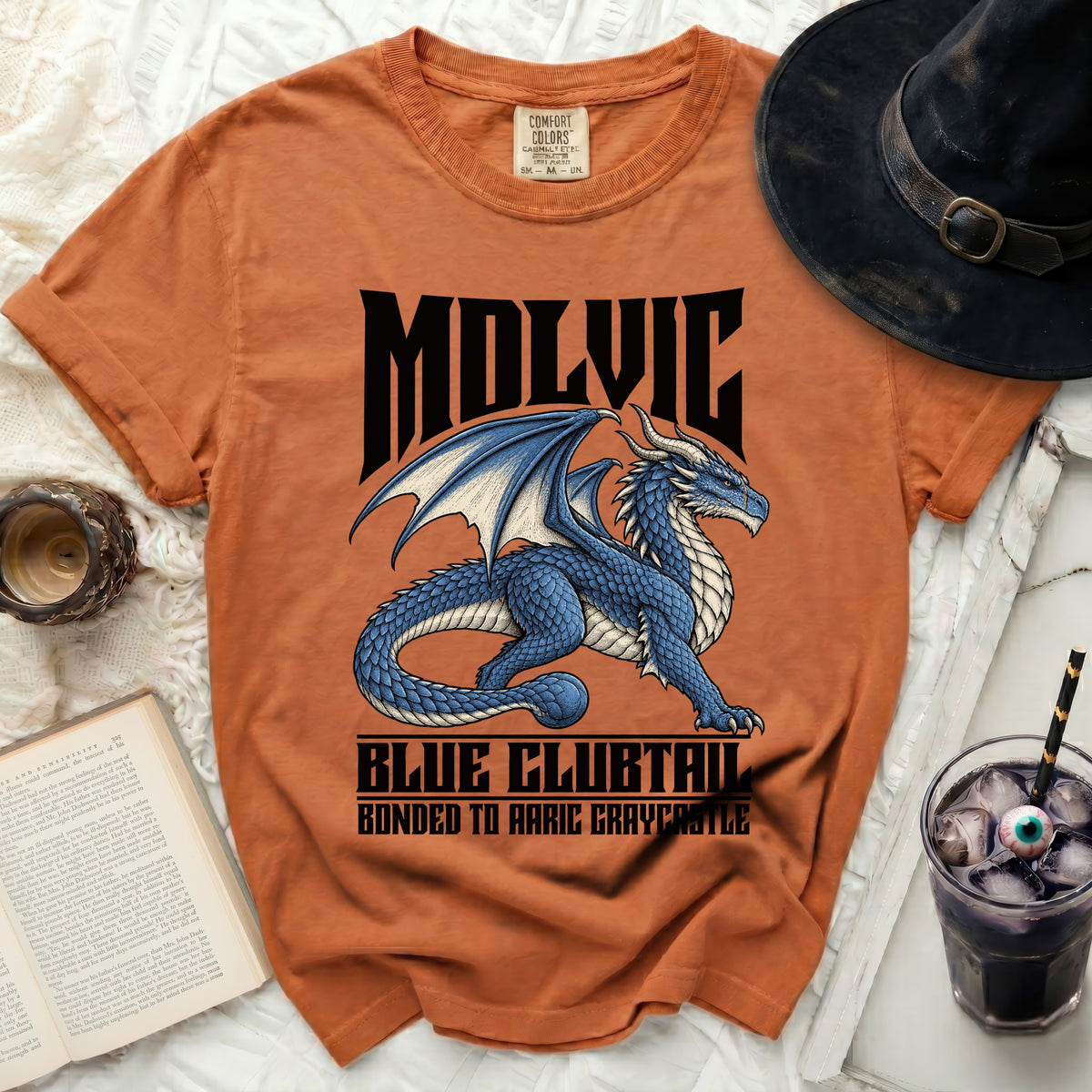 Orange t-shirt with a blue dragon graphic and text "MOLVIC BLUE CLUBTAIL BONDED TO AARIC GRAYCASTLE".