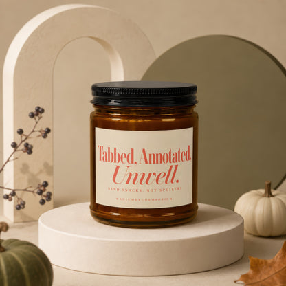 Amber glass candle with "Tabbed, Annotated. Unwell. SEND SNACKS, NOT SPOILERS" text.