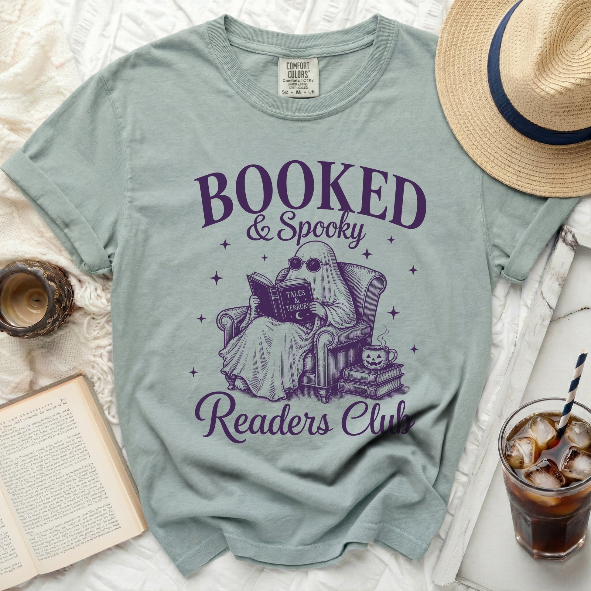 Booked & Spooky Readers Club graphic t-shirt with ghost reading.