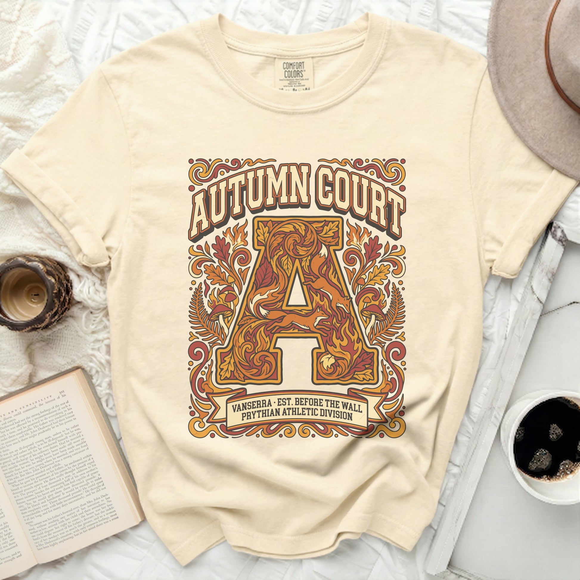 Cream t-shirt with "Autumn Court" and athletic division logo.
