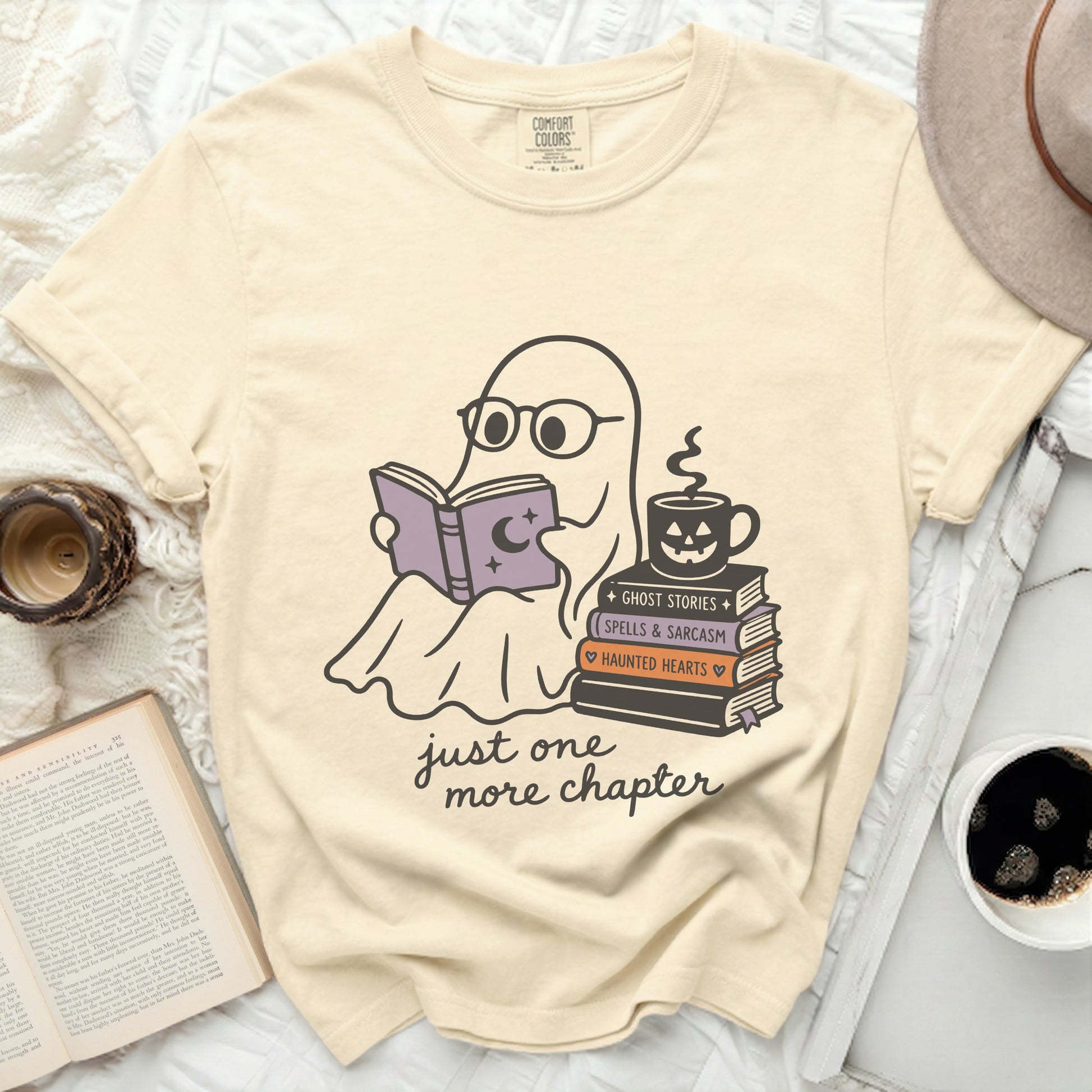 T-shirt with ghost reading books and coffee, text "just one more chapter".
