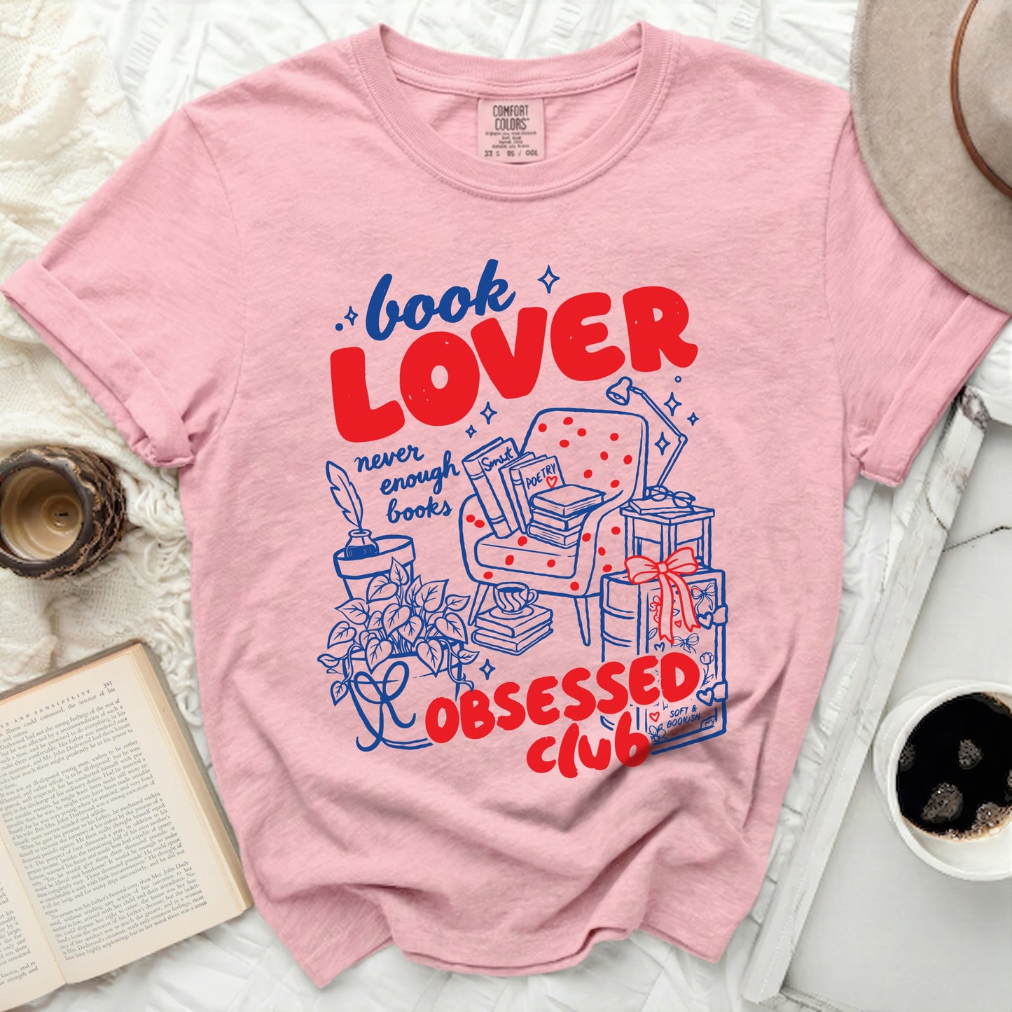 Pink t-shirt with "Book Lover Never Enough Books Obsessed Club" graphic.