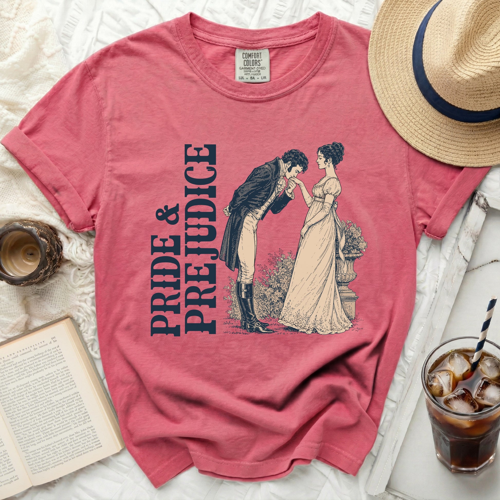 Pink t-shirt with "Pride & Prejudice" text and illustration