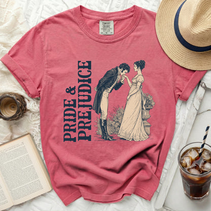 Pink t-shirt with "Pride & Prejudice" text and illustration