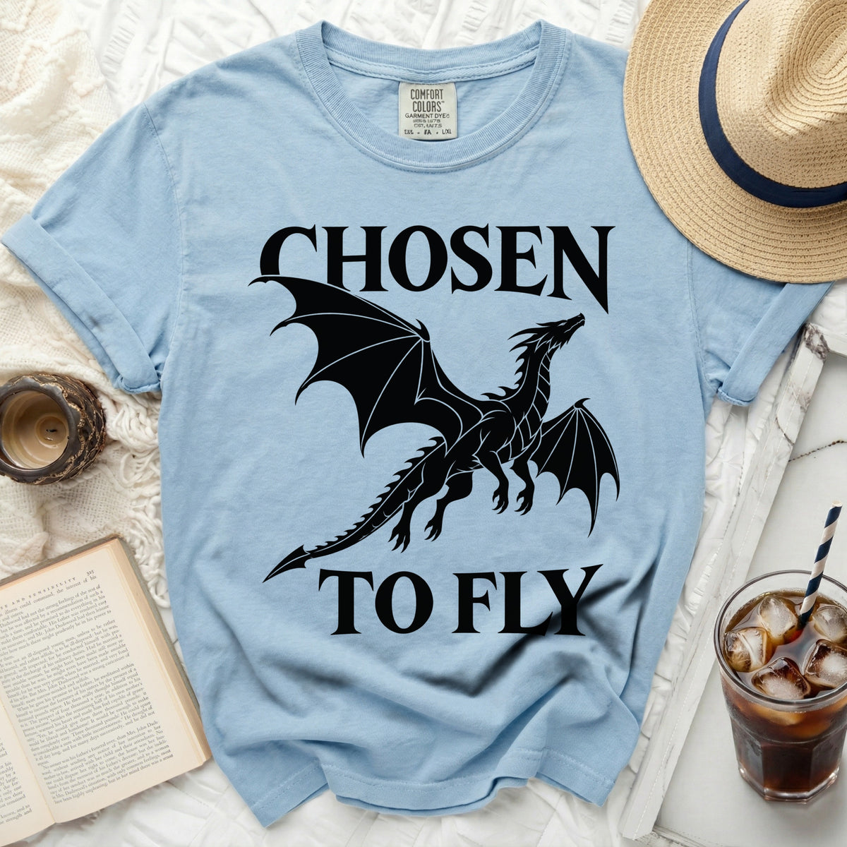 Light blue t-shirt with black dragon and text "CHOSEN TO FLY".