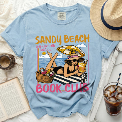 Light blue t-shirt with "Sandy Beach Book Club" graphic.