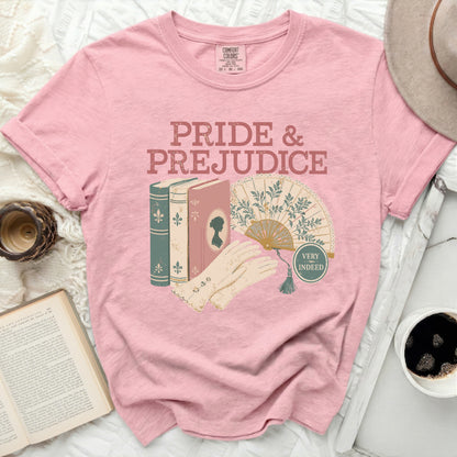 Pink t-shirt with "Pride & Prejudice" text, books, fan, and gloves.