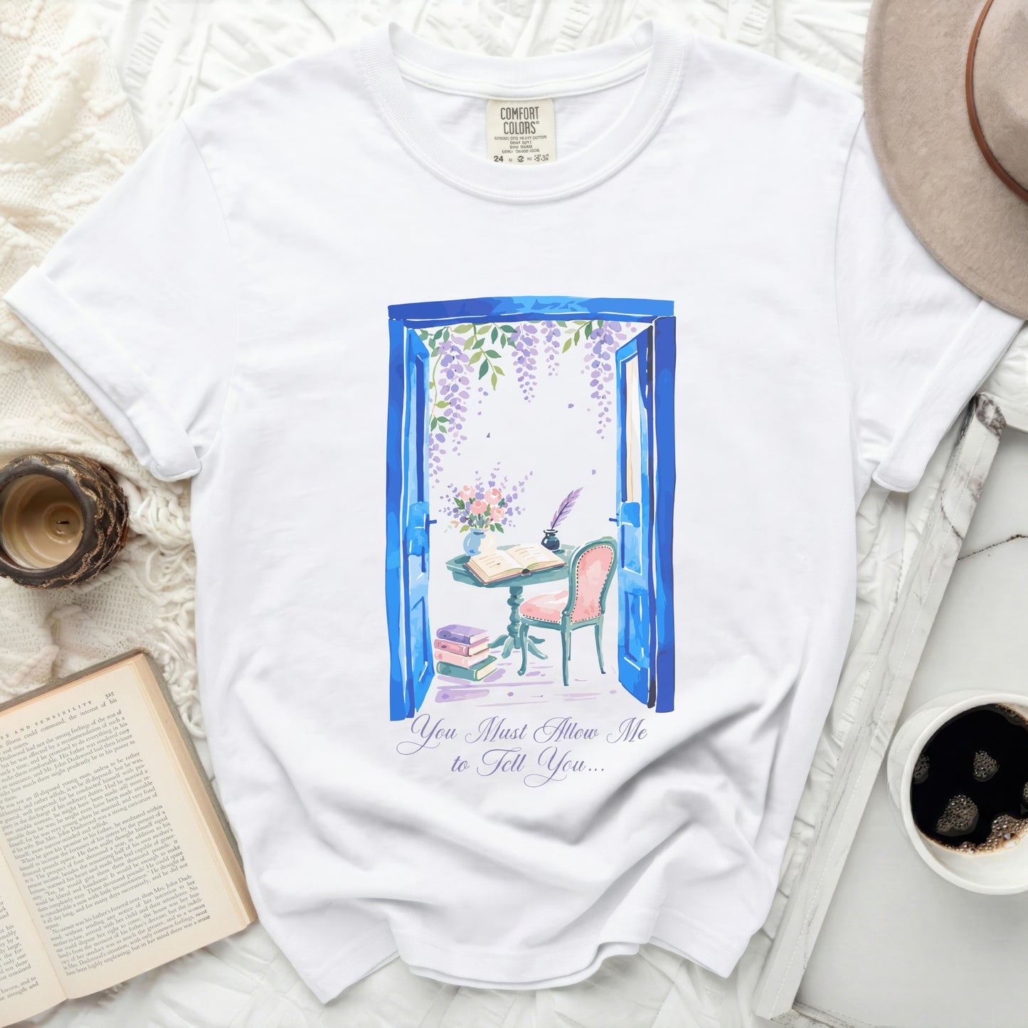 White t-shirt with blue doorway, wisteria, and writing desk graphic.