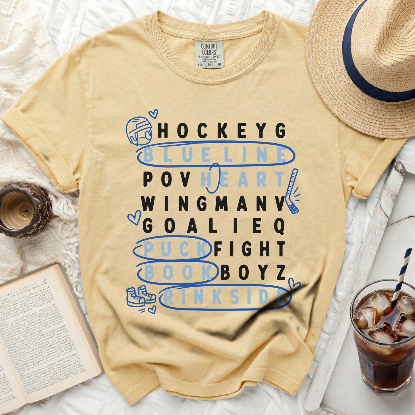 Yellow t-shirt with hockey terms listed vertically in blue letters.