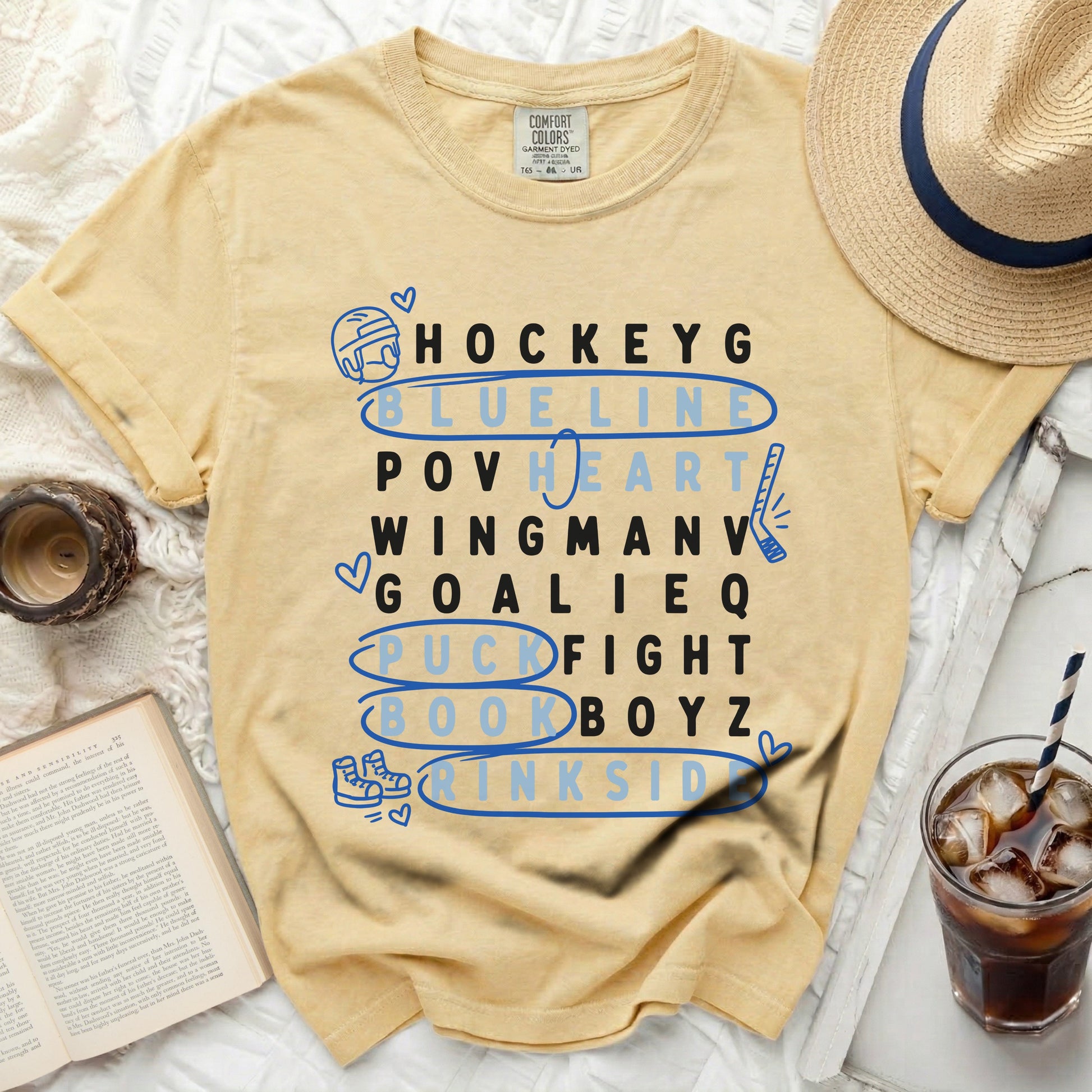 Yellow t-shirt with hockey terms listed vertically in blue letters.