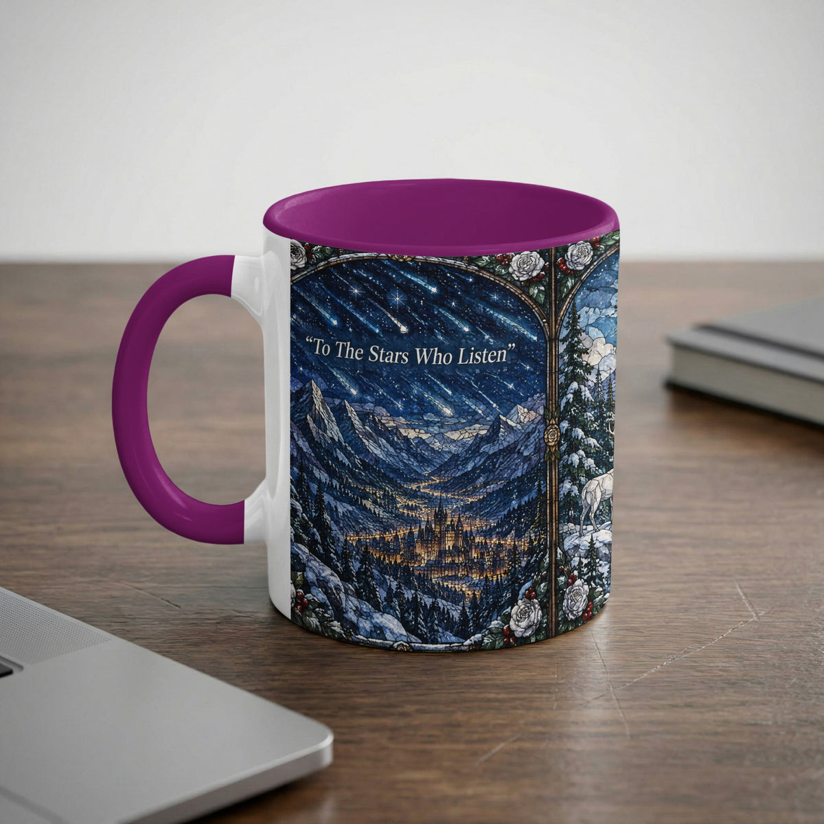 A white ceramic mug with a purple handle and rim featuring a fantasy mountain landscape illustration.