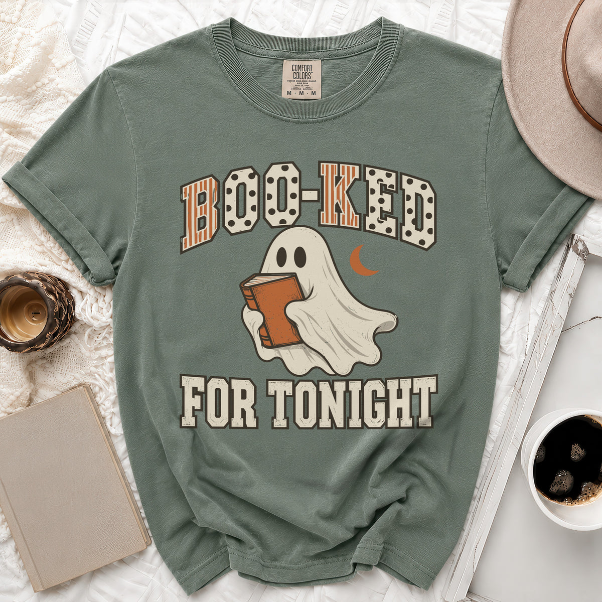 T-shirt with ghost reading a book and text "Boo-ked for tonight".