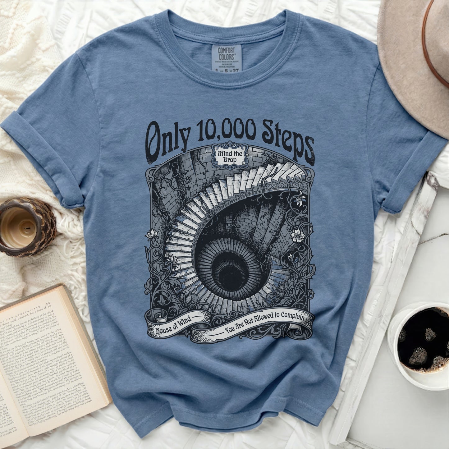 Blue t-shirt with "Only 10,000 Steps" and a spiral staircase graphic.