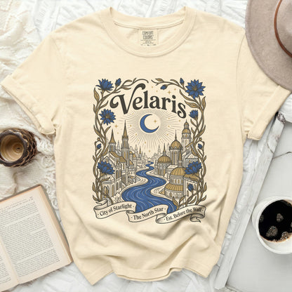 Cream t-shirt with "Velaris City of Starlight" design featuring a moonlit city and floral accents.