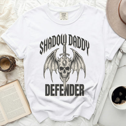 White t-shirt with "Shadow Daddy Defender" graphic.