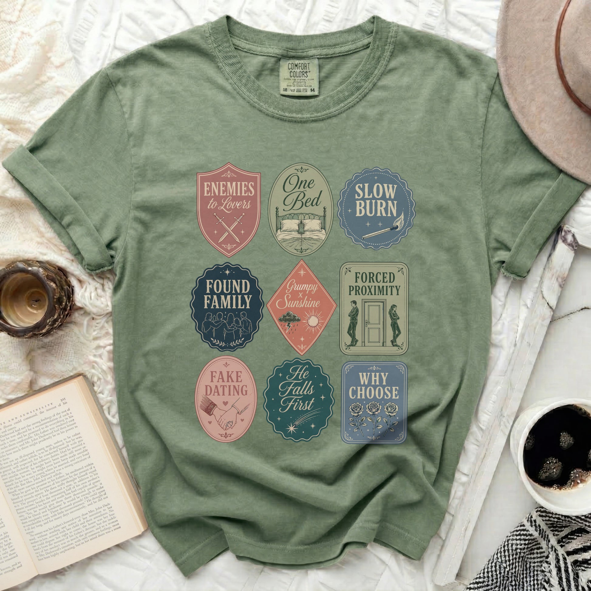 Olive green t-shirt with nine embroidered patch designs.