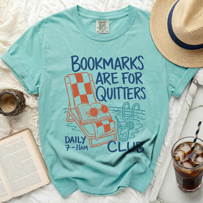 Aqua t-shirt with "Bookmarks Are For Quitters" and pool illustration.