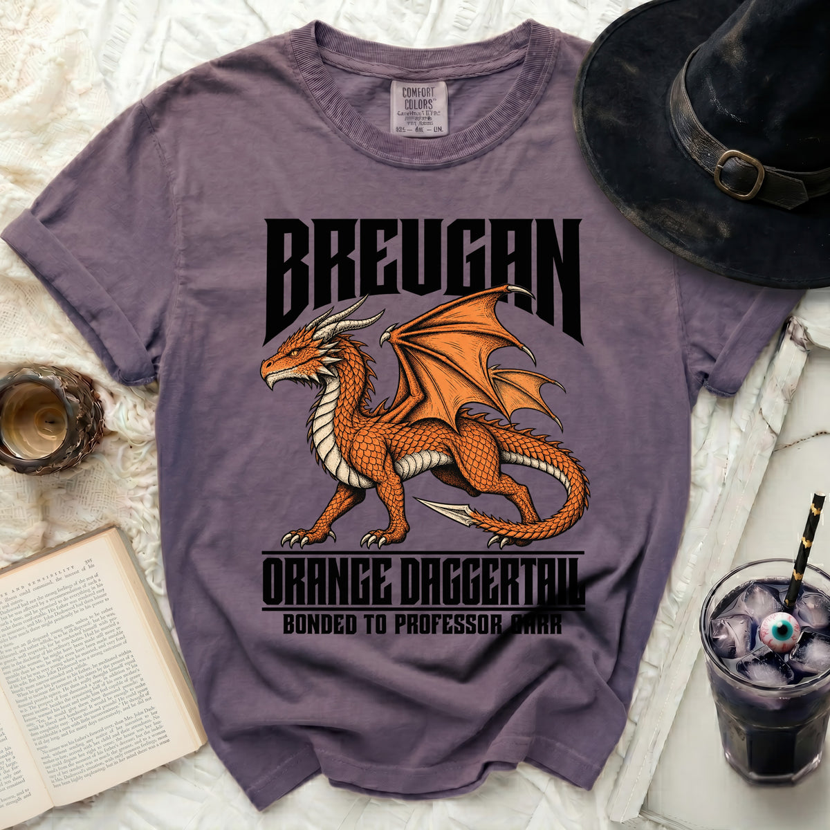 Purple t-shirt with orange dragon graphic and text "BREUGAN", "ORANGE DAGGERTAIL", "BONDED TO PROFESSOR BARR".