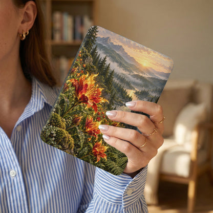 Case with vibrant lilies, misty mountains, and a sunrise landscape at sunset.
