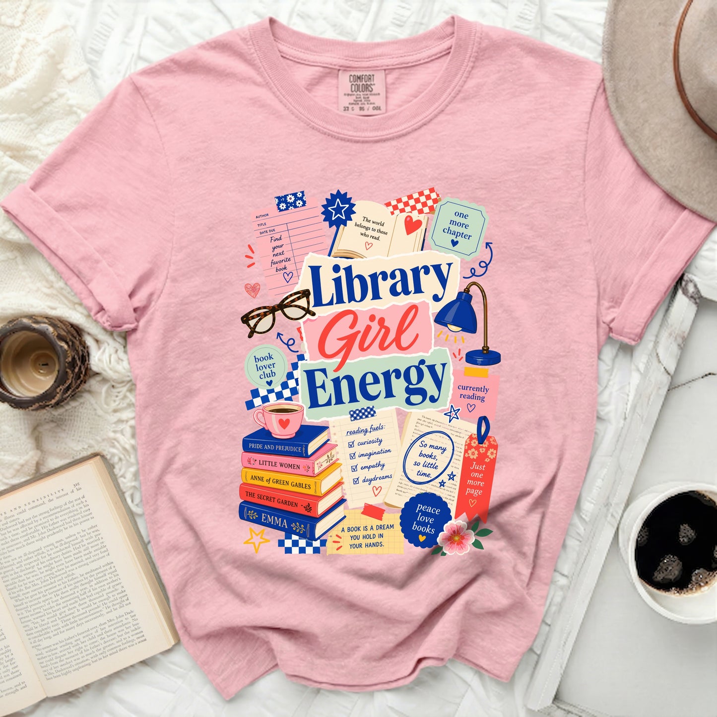 Pink t-shirt with "Library Girl Energy" and book-themed graphics.