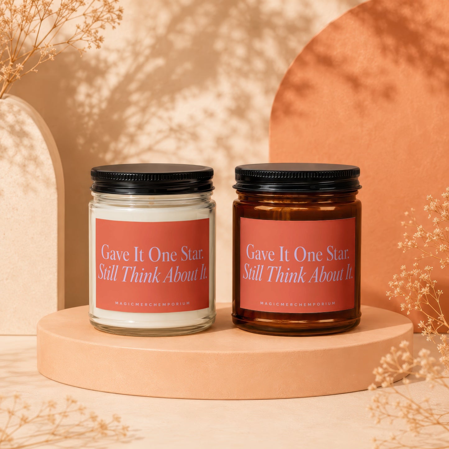 Two scented candles with text "Gave It One Star. Still Think About It."
