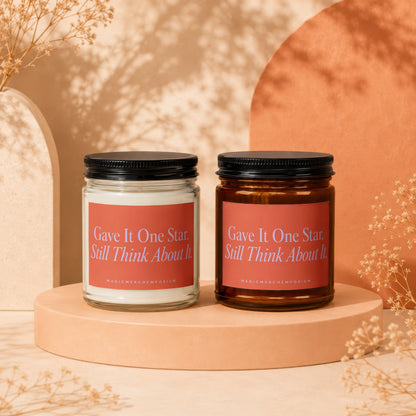 Two scented candles with text "Gave It One Star. Still Think About It."