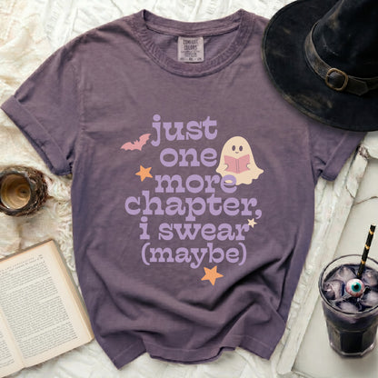 Purple t-shirt with ghost reading book and "Just one more chapter, I swear (maybe)" text.