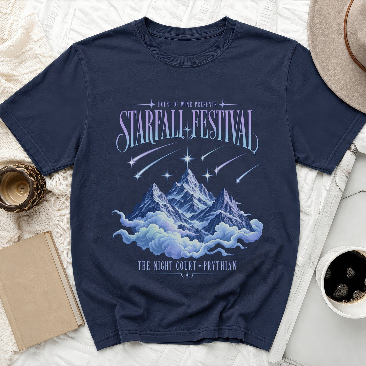 Navy t-shirt with "Starfall Festival" text, mountains, clouds, and shooting stars design.