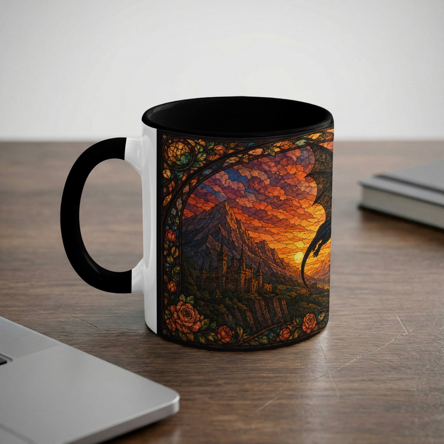 White mug with black handle featuring stained-glass dragon, castle, and mountain landscape.