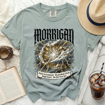Light blue t-shirt with "MORRIGAN" and lightning graphic.