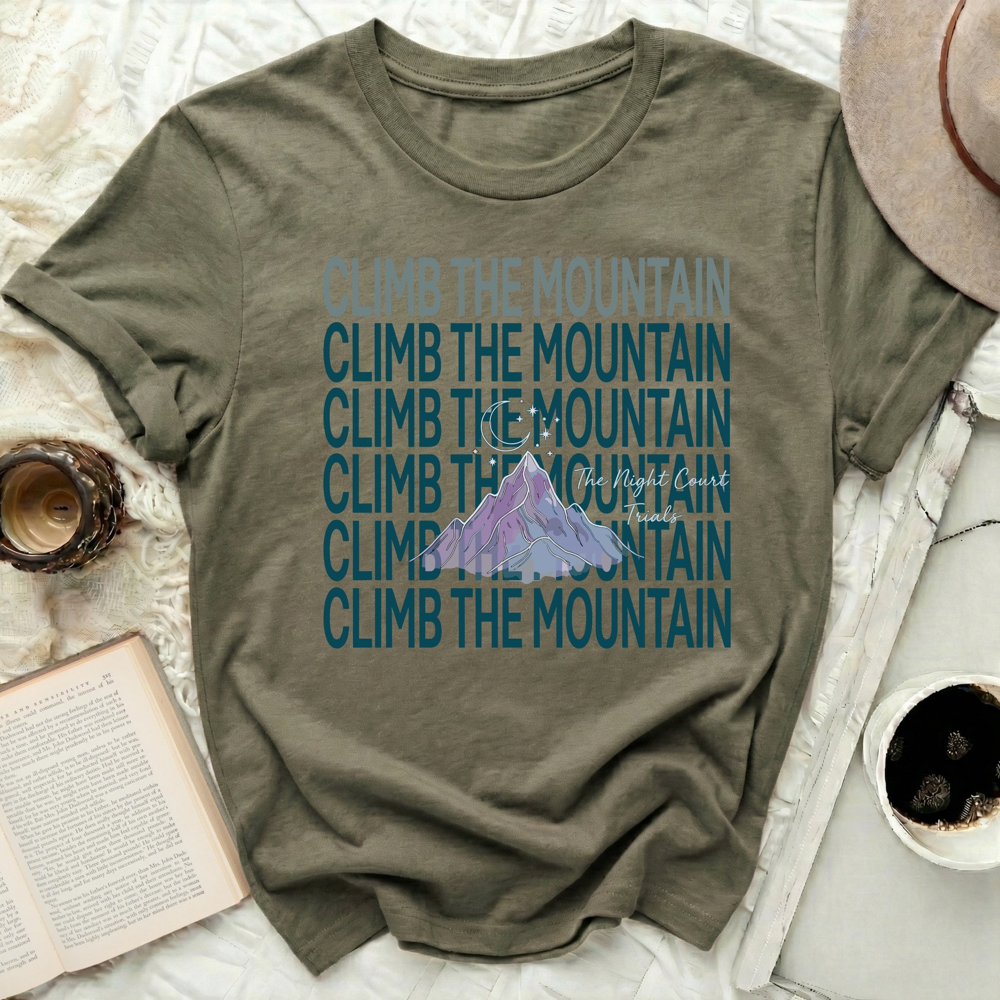 CLIMB THE MOUNTAIN Night Court Trials T-Shirt product type
Climb the Mountain, Night Court, Trials, Mountain graphic, Moon and Stars, Fantasy inspired, Bookish design, Reading fan, Nature adventure, Outdoor theme, Inspirational quote, Olive green tee, Unique design, Casual graphic, Adventure seeker, Fae kingdom, SJM books, ACOTAR style, Mystical design, Literary inspired