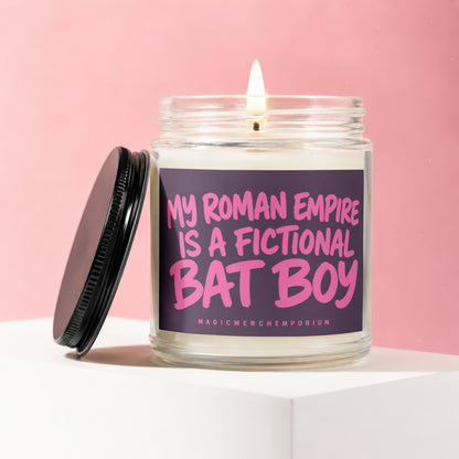 Jar candle with lit wick and black lid, text reads "My Roman Empire is a fictional Bat Boy".