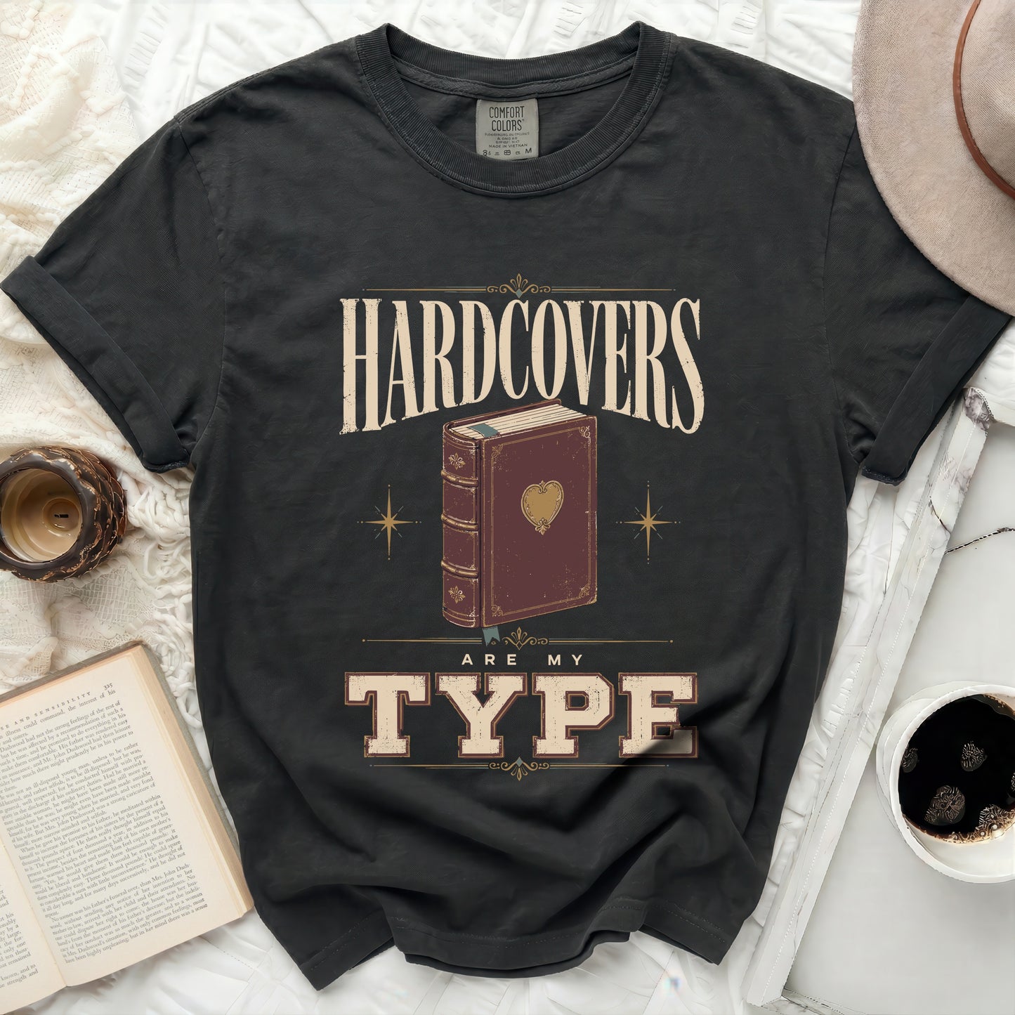 T-shirt with "Hardcovers Are My Type" text and a book illustration.
