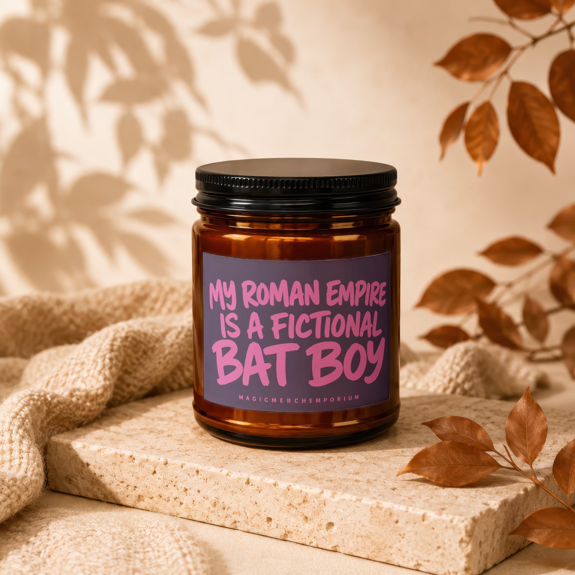 Candle with "My Roman Empire is a Fictional Bat Boy" text on purple label.