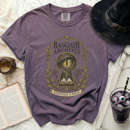 Purple t-shirt with "Basgiath Archives Knowledge is Power" text and dragon eye design.