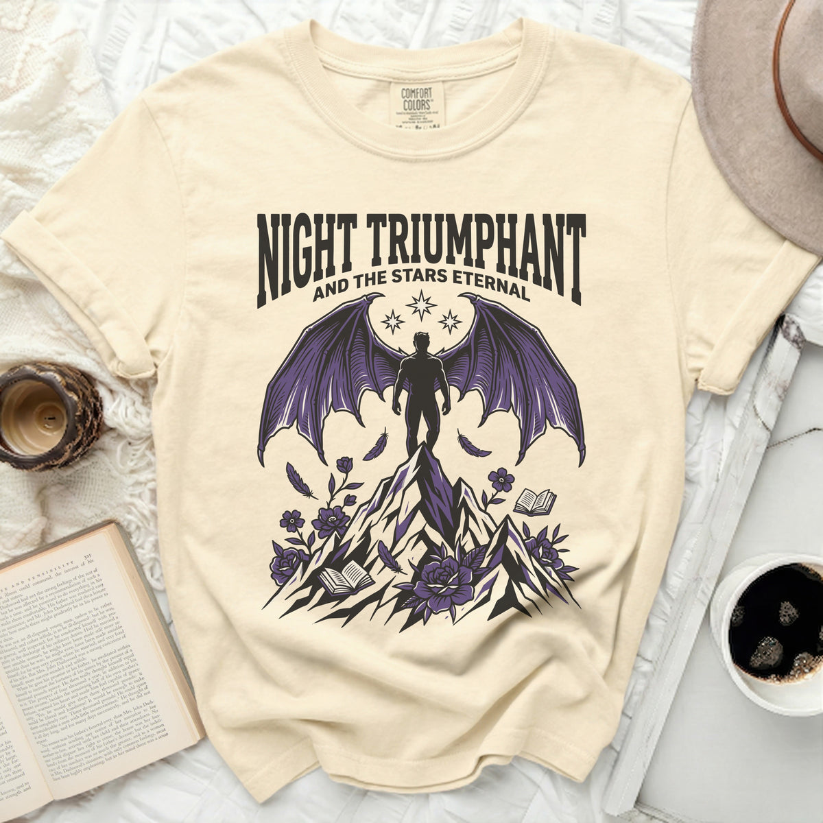 Night Triumphant and the Stars Eternal graphic tee with winged figure.