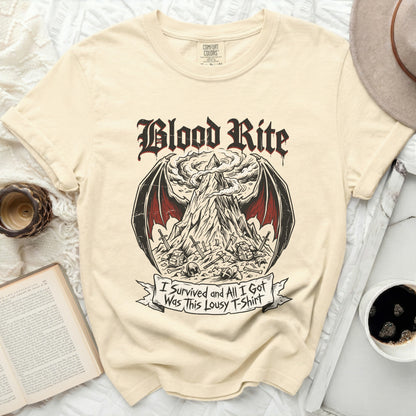 Cream t-shirt with "Blood Rite" graphic and "I Survived and All I Got Was This Lousy T-Shirt" text.