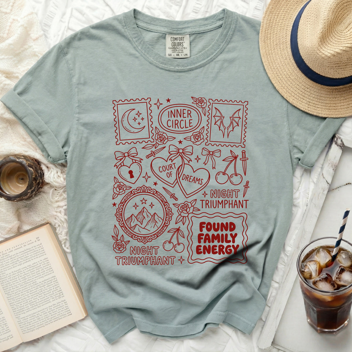 Green t-shirt with red distressed graphic featuring moons, bats, hearts, and text.