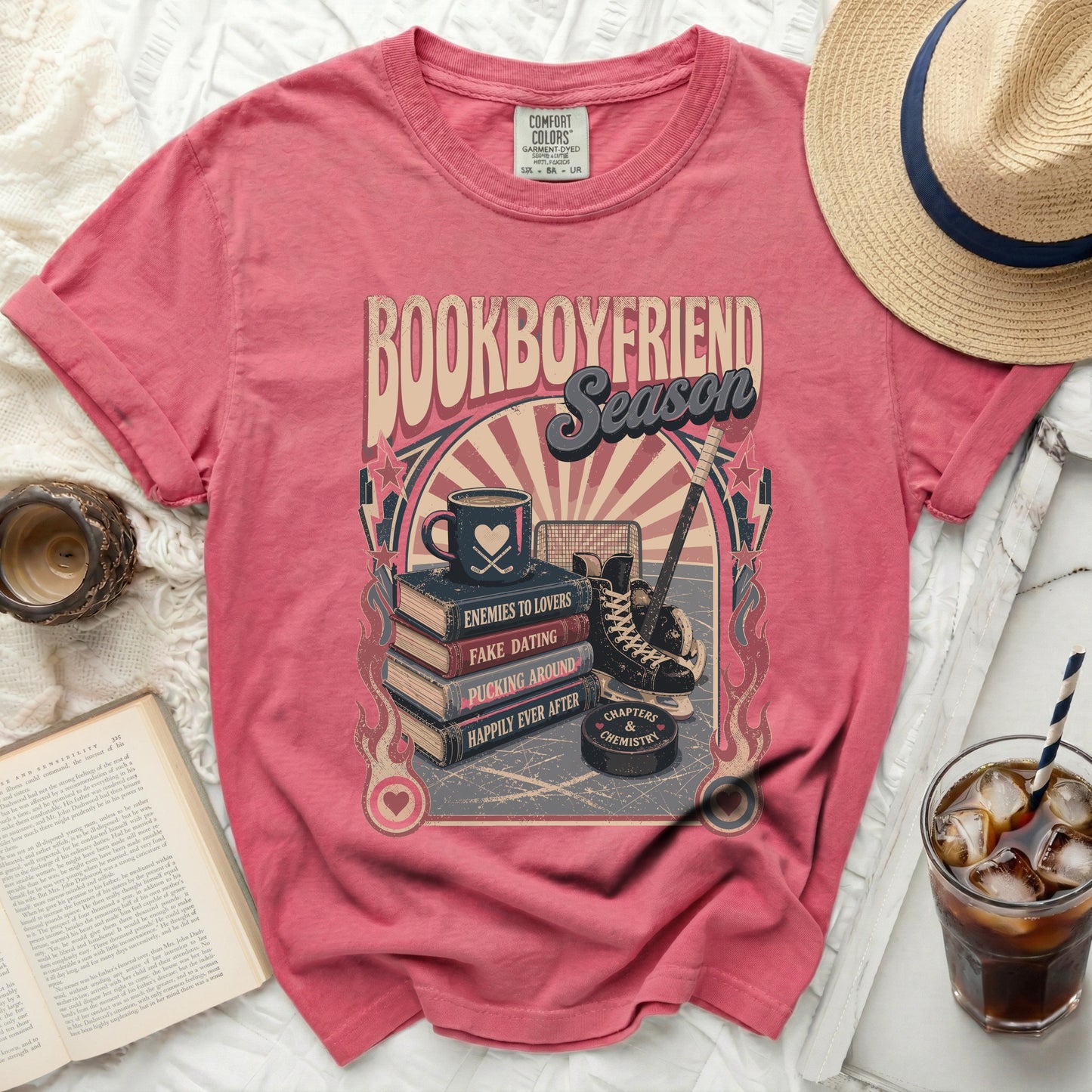 T-shirt graphic with "Bookboyfriend Season" text, hockey puck, skates, and coffee cup.
