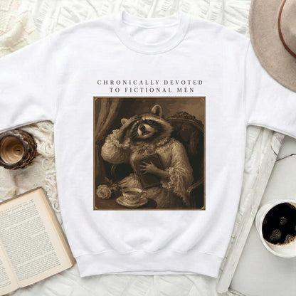 Crewneck sweatshirt with raccoon in Victorian attire and text "CHRONICALLY DEVOTED TO FICTIONAL MEN".