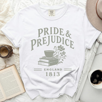 White t-shirt with "Pride & Prejudice England 1813" text and teacup on books graphic.