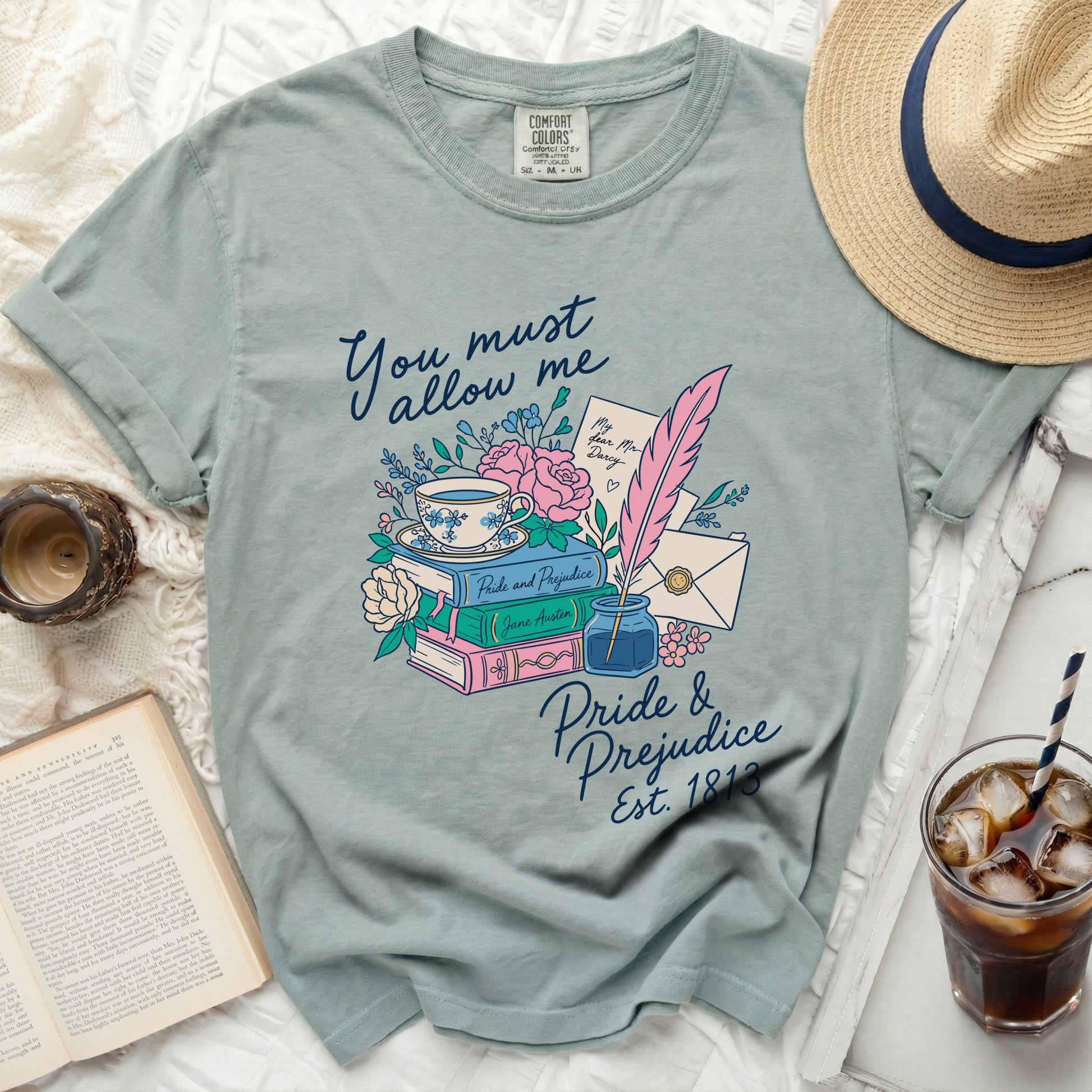Light blue t-shirt with Pride and Prejudice quote and illustration.