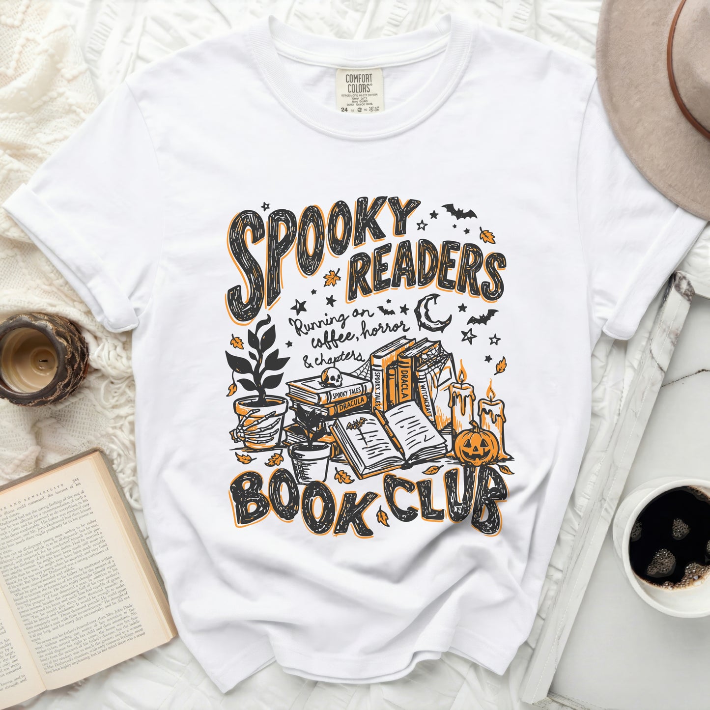 White t-shirt with "Spooky Readers Book Club" Halloween graphic.