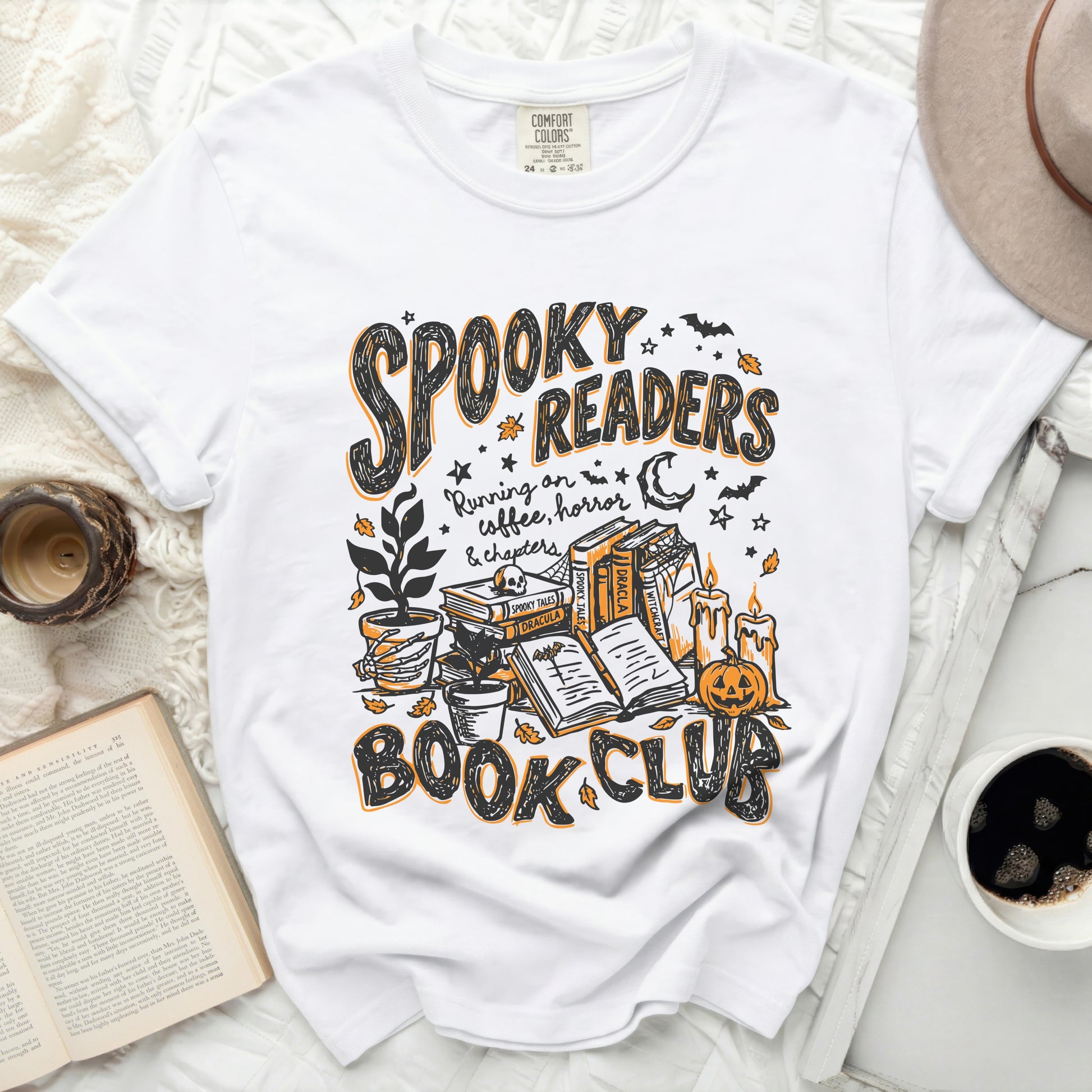 White t-shirt with "Spooky Readers Book Club" Halloween graphic.