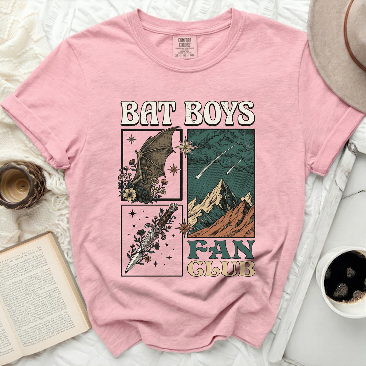 Pink t-shirt with "BAT BOYS FAN CLUB" graphic featuring a bat, dagger, and mountains.