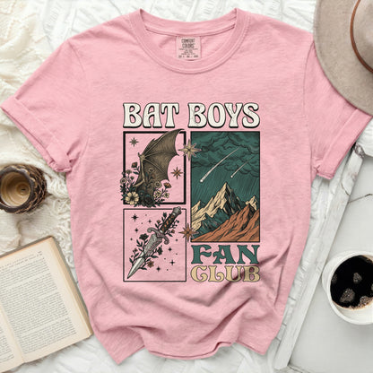 Pink t-shirt with "BAT BOYS FAN CLUB" graphic featuring a bat, dagger, and mountains.