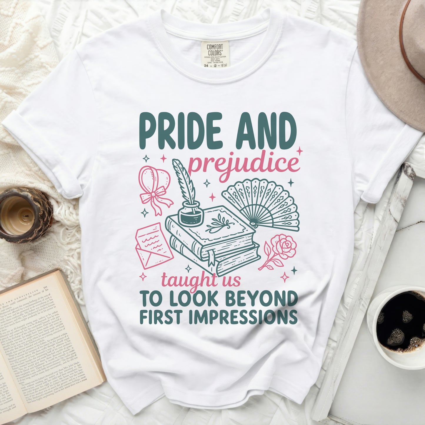 White Comfort Colors t-shirt with "Pride and Prejudice" graphic and quote "Taught us to look beyond first impressions."