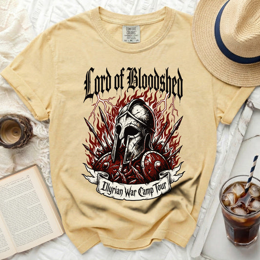 Yellow t-shirt with "Lord of Bloodshed Illyrian War Camp Tour" graphic.