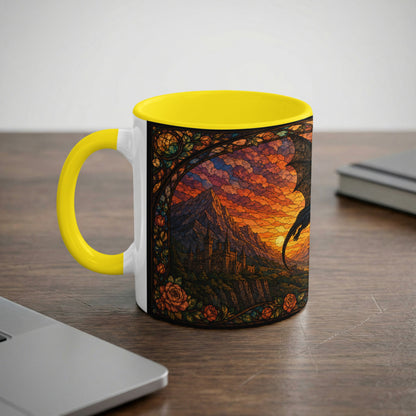 Mug with yellow handle and interior featuring stained glass art of a dragon over a castle at sunset.